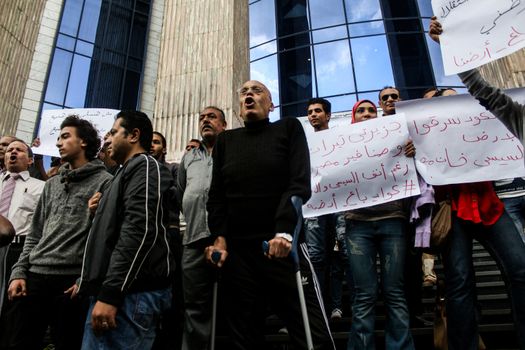 EGYPT, Cairo: Protesters hold banners against Egypt's decision to cede sovereignty over two Red Sea islands, Sanafir and Tiran, to Saudi Arabia on April 13, 2016 in Cairo, before the syndicate of journalists building. Online, many Egyptians have accused their once-popular President, Abdel-Fattah el-Sissi, of giving up land to curry favor with the Saudis. On Twitter, the hashtag I feel like selling what to Saudi Arabia trended on April 12, 2016 with commentators suggesting Egypt flog everything from self-serving lawmakers to President Abdel-Fattah el-Sissi himself.