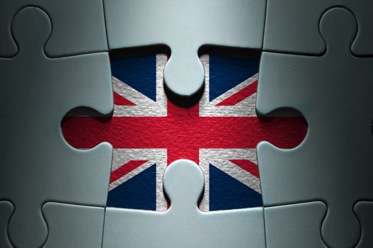 Missing piece from a jigsaw puzzle revealing the British flag 