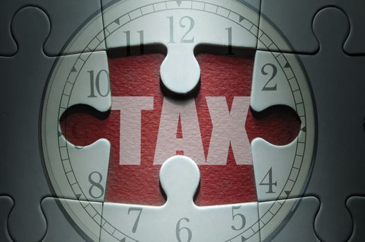 Missing piece from a clock jigsaw puzzle with tax in the center 