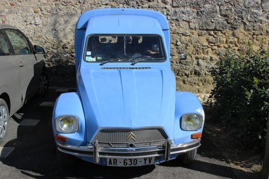 Perouges, France - March 26, 2016: Blue Citroen Acadiane Parked in the Street of Perouges, France