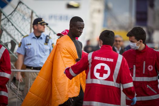 ITALY, Palermo: At least 890 migrants and refugees mostly from North Africa disembark from Siem Pilot, a Norwegian-flagged ship taking part in the Frontex mission, on April 13, 2016 in Palermo harbour, in Sicily, according to local media. Italy's coastguard said on April 12, 2016 it had rescued some 4,000 migrants in the past two days, adding to fears of a fresh push to reach Europe via that route as the number of migrants landing in Greece sharply recedes.