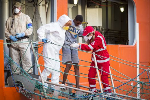 ITALY, Palermo: At least 890 migrants and refugees mostly from North Africa disembark from Siem Pilot, a Norwegian-flagged ship taking part in the Frontex mission, on April 13, 2016 in Palermo harbour, in Sicily, according to local media. Italy's coastguard said on April 12, 2016 it had rescued some 4,000 migrants in the past two days, adding to fears of a fresh push to reach Europe via that route as the number of migrants landing in Greece sharply recedes.