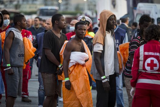 ITALY, Palermo: At least 890 migrants and refugees mostly from North Africa disembark from Siem Pilot, a Norwegian-flagged ship taking part in the Frontex mission, on April 13, 2016 in Palermo harbour, in Sicily, according to local media. Italy's coastguard said on April 12, 2016 it had rescued some 4,000 migrants in the past two days, adding to fears of a fresh push to reach Europe via that route as the number of migrants landing in Greece sharply recedes.