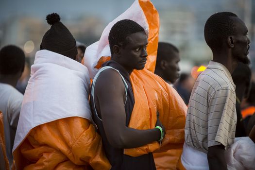 ITALY, Palermo: At least 890 migrants and refugees mostly from North Africa disembark from Siem Pilot, a Norwegian-flagged ship taking part in the Frontex mission, on April 13, 2016 in Palermo harbour, in Sicily, according to local media. Italy's coastguard said on April 12, 2016 it had rescued some 4,000 migrants in the past two days, adding to fears of a fresh push to reach Europe via that route as the number of migrants landing in Greece sharply recedes.