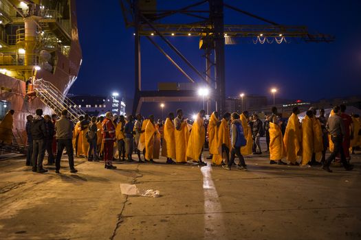 ITALY, Palermo: At least 890 migrants and refugees mostly from North Africa disembark from Siem Pilot, a Norwegian-flagged ship taking part in the Frontex mission, on April 13, 2016 in Palermo harbour, in Sicily, according to local media. Italy's coastguard said on April 12, 2016 it had rescued some 4,000 migrants in the past two days, adding to fears of a fresh push to reach Europe via that route as the number of migrants landing in Greece sharply recedes.