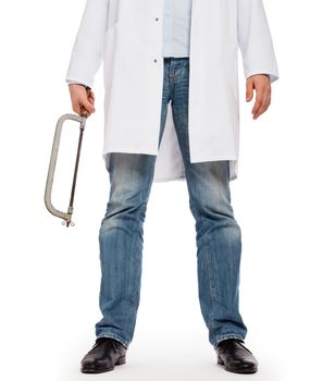 Crazy doctor is holding a big saw in his hands, isolated on white