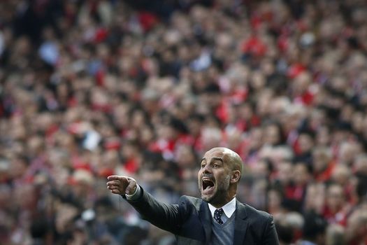 PORTUGAL, Lisbon: Josep Guardiola, head coach of Bayern Munich known as Pep Guardiola, reacts during the UEFA Champions League Quarter Final Second Leg match between SL Benfica and FC Bayern Munchen at Estadio da Luz on April 13, 2016 in Lisbon, Portugal. Bayern Munich reached the Champions League semi-finals for the fifth consecutive season. 