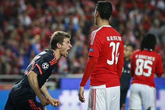 PORTUGAL, Lisbon: Football player Thomas Müller of Bayern Munich celebrates after he scores a goal during the UEFA Champions League Quarter Final Second Leg match between SL Benfica and FC Bayern Munchen at Estadio da Luz on April 13, 2016 in Lisbon, Portugal. Bayern Munich reached the Champions League semi-finals for the fifth consecutive season. 