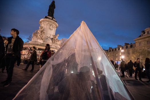 FRANCE, Paris: Participants stroll and sit in a makeshift tent during the Nuit Debout (Up All Night) movement on the Place de la Republique in Paris on April 13, 2016. The Nuit Debout or Up All Night protests began in opposition to the Socialist government's labour reforms seen as threatening workers' rights, but have since gathered a number of causes, from migrants' rights to anti-globalisation.