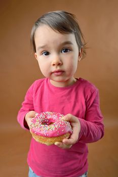 Little girl with sweet donut