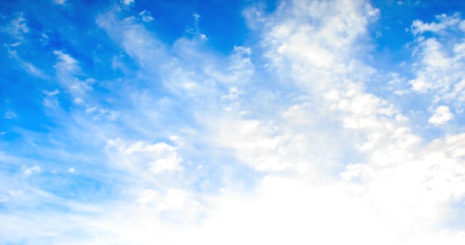 Blue sky with tiny clouds