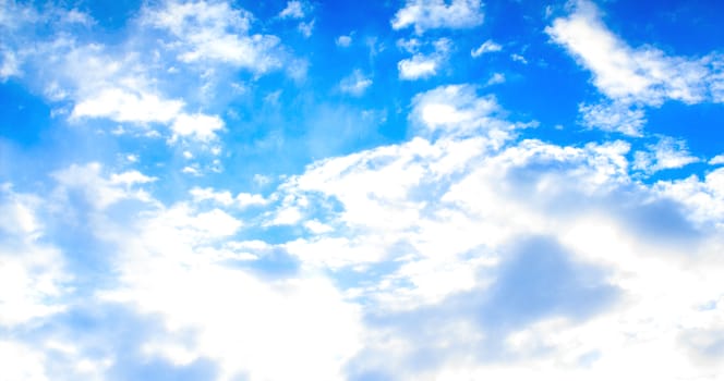 Blue sky with tiny clouds