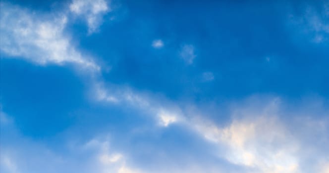 Blue sky with tiny clouds