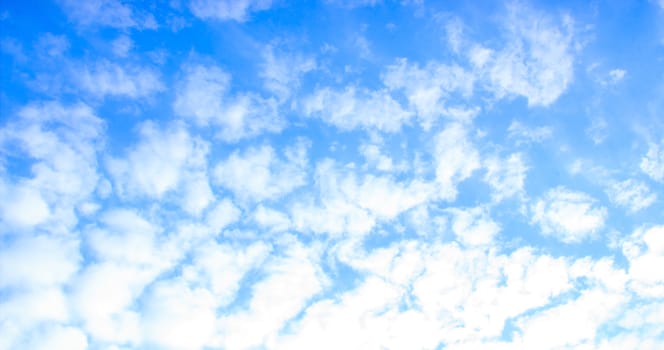 Blue sky with tiny clouds