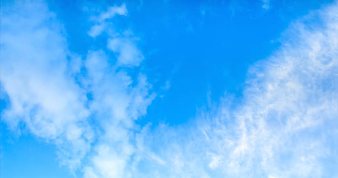 Blue sky with tiny clouds