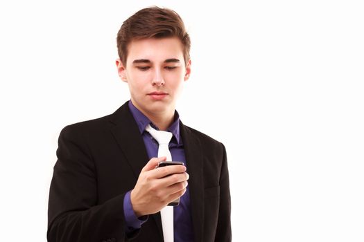 Young businessman seriously looking to the phone isolated on white