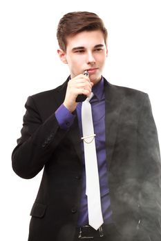 Portrait of a man in suit smoking an e-cigarette isolated on white