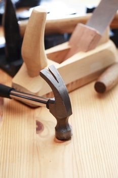 Set of carpenter tools on wooden workbench