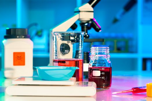 researchers work in modern scientific lab. Preparation of hazardous solution