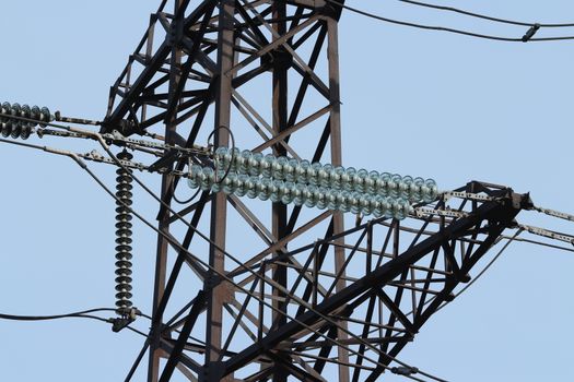 High-voltage electrical insulator electric line against the blue sky