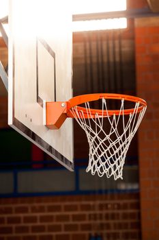 Photo of an indoor basketball hoop.
