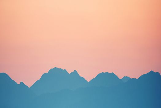 Beautiful orange sunset over mountains. Cagliari, Sardinia, Italy.