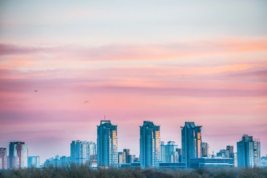 Spectacular sunset city view with bridge over Dnepr river. Kiev, Ukraine