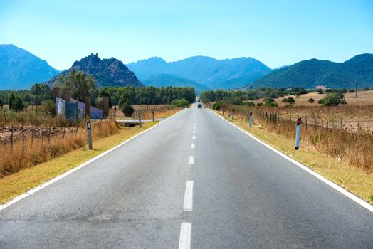 Highway road. Travel landscape with mountains on horizon