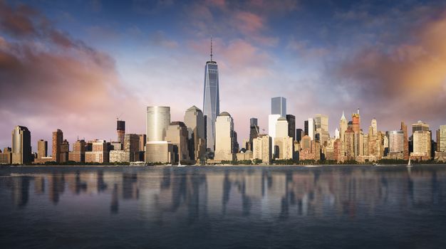 New York City skyline with urban skyscrapers at sunset, USA.