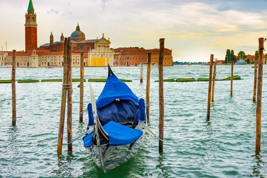 Gondola at sunset near the Piazza San Marco, Venice, Italy.