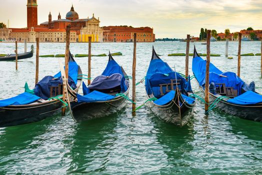 Gondolas at sunset near the Piazza San Marco, Venice, Italy.