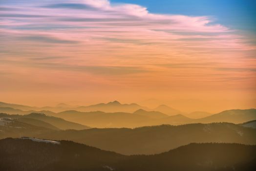 Sunset in winter mountains covered with snow.