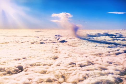 Blue sky and clouds. Plane view above the earth, can be used for background