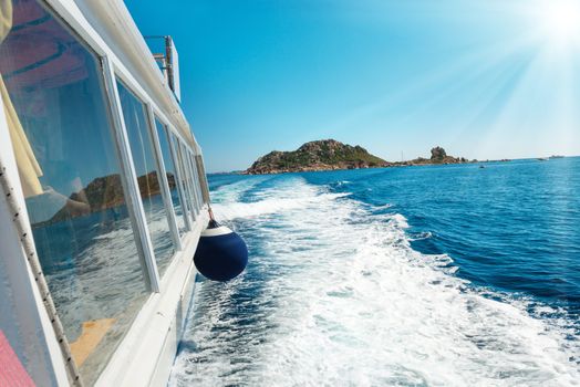 Waves on blue sea behind the speed boat in sunny day