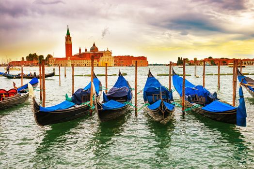 Gondolas at sunset near the Piazza San Marco, Venice, Italy.