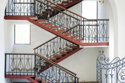 Ramp and staircases that turns inside a building, details of modern urban house