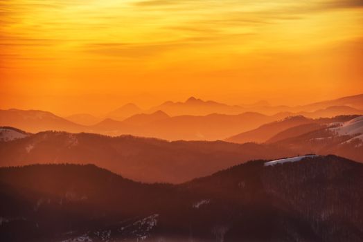 Sunset in winter mountains covered with snow.