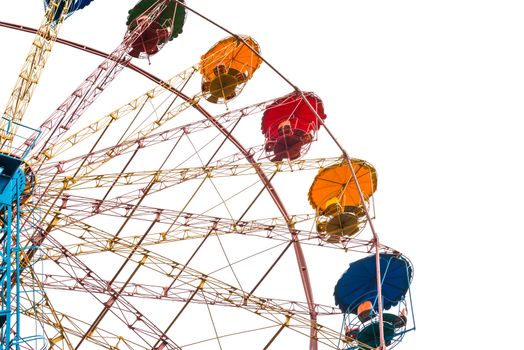 Ferris wheel in the green park isolated on white background