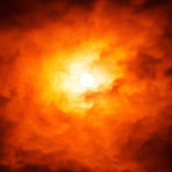 Abstract night view on the moon through moving clouds.