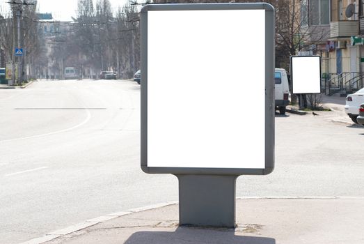 Vertical blank billboard white isolated on the city street