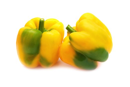 Two yellow peppers paprika isolated on white background