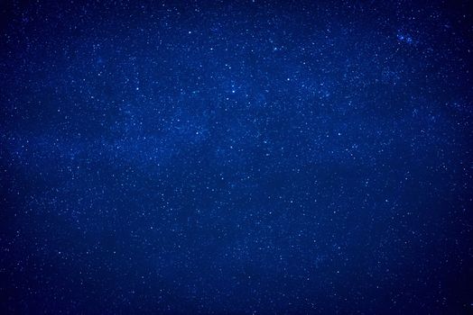 Blue dark night sky with many stars. Milky way like space background