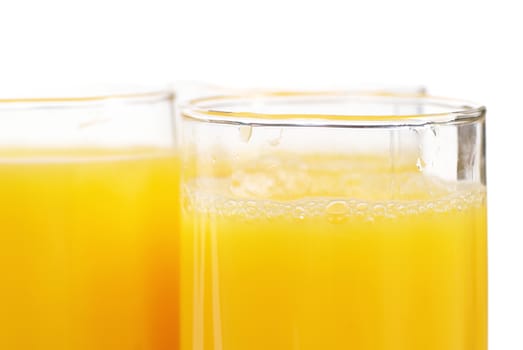 Glasses full of fresh orange juice isolated on white