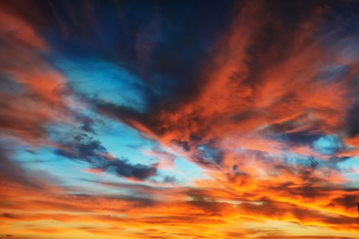 Colorful orange and blue dramatic sky with clouds for abstract background