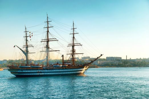 Beautiful ship sailboat in the blue sea comes into bay