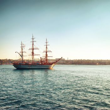 Beautiful sailing vessel in the sea comes into bay