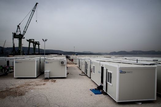 GREECE, Skaramagas: As thousands of refugees remain stranded in Greece, storage containers have been placed as homes for 1,000 people at a new camp in Skaramagas, near Athens on April 14, 2016. They have just been relocated here after being stranded at the port of Piraeus, where they originally landed.
