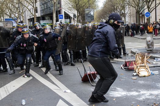 FRANCE, Paris: Riot policemen try to scatter a crowd of protesters as hundreds demonstrate against the French government's proposed labour law reforms on April 14, 2016 in Paris. Fresh strikes by unions and students are being held across France against proposed reforms to France's labour laws, heaping pressure on President Francois Hollande who suffered a major defeat over constitutional reforms on March 30.