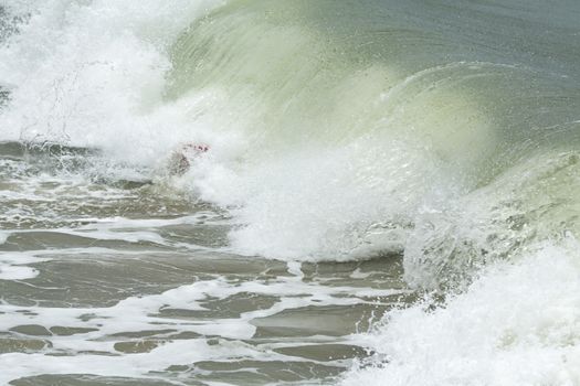 Body border under the wave. Surfing training beginning