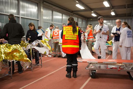 FRANCE, Toulouse: Civilians, medical staff, firemen and rescuers take part in a simulation exercice of terrorist attack at the Toulouse stadium on April 14, 2016 as part of the Euro 2016. 